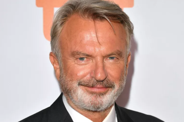 Sam Neill at a public event, remembered following the announcement of his cause of death and plans for a private memorial in New Zealand.
