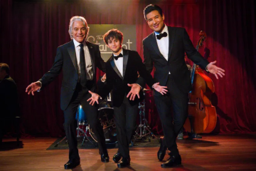 Tony Danza, Mario Lopez, and Dominic Lopez in a festive scene from Christmas at The Starlight.