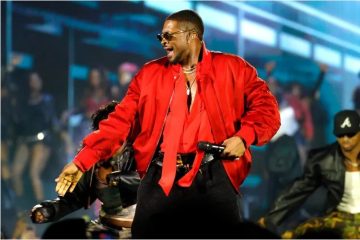 Usher performing during his Nashville concert before respectfully ending an onstage interaction with a fan.