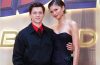 Zendaya and Tom Holland attending the Spider-Man: Brand New Day premiere, smiling together on the red carpet.