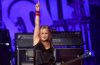 Jennifer Finch performing on stage with L7 before stepping away from the band's farewell tour following her brain cancer diagnosis.