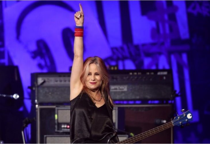 Jennifer Finch performing on stage with L7 before stepping away from the band's farewell tour following her brain cancer diagnosis.