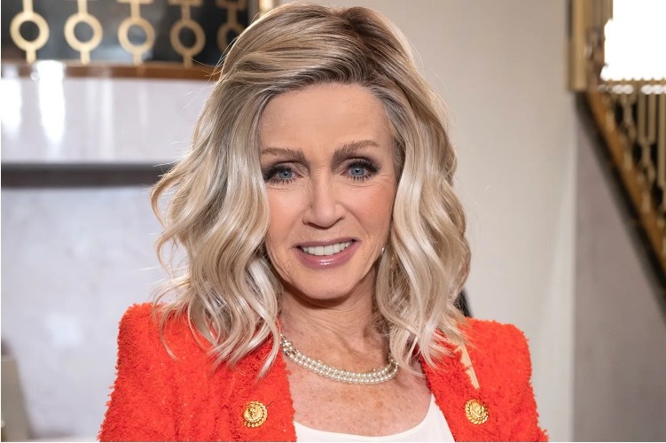 Donna Mills smiling during a public appearance as the veteran actress announces her new OnlyFans account to connect more closely with fans.