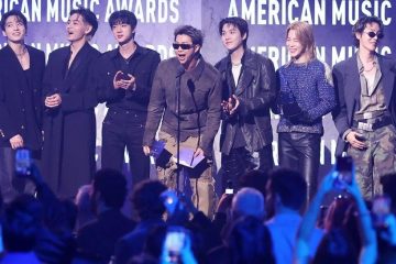 The seven BTS members during a group appearance after announcing they will not submit music for the 2027 Grammy Awards.