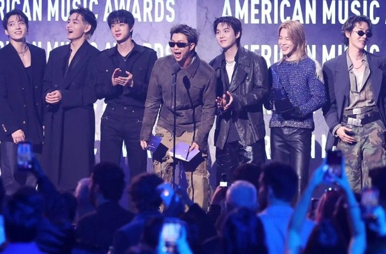 The seven BTS members during a group appearance after announcing they will not submit music for the 2027 Grammy Awards.