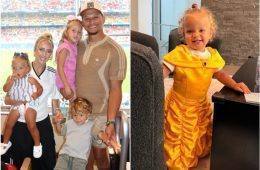 Golden Mahomes smiles while dressed as Belle from Beauty and the Beast in a princess costume.