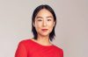 Greta Lee attends a red carpet event while reflecting on her career journey and finding success later in Hollywood.