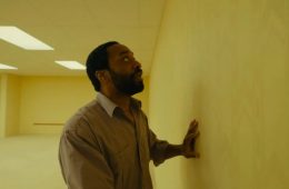 A haunting scene from A24's Backrooms featuring the film's signature endless yellow hallways now available to watch at home.