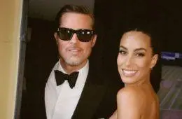 Brad Pitt and Ines de Ramon pose together before attending Taylor Swift and Travis Kelce's wedding in New York City.