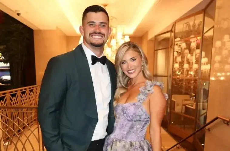 Jackie Tranquill poses with the Chanel handbag she won during Taylor Swift and Travis Kelce's wedding raffle.
