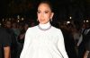 Jennifer Lopez wearing a couture gown and sparkling diamond jewelry while celebrating her 57th birthday in Paris.