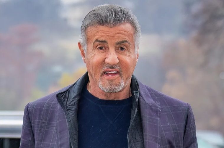 Sylvester Stallone attending a movie premiere, highlighting his legendary career as an actor, writer, director, and producer.