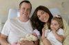 Campbell "Pookie" Puckett and Jett Puckett pose with their two daughters in their first family photos as a family of four.
