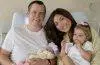 Campbell "Pookie" Puckett and Jett Puckett pose with their two daughters in their first family photos as a family of four.