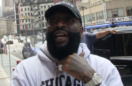 Rick Ross speaking at an event after expressing interest in purchasing an ownership stake in the Miami Dolphins NFL franchise.