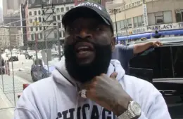 Rick Ross speaking at an event after expressing interest in purchasing an ownership stake in the Miami Dolphins NFL franchise.