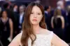 Mia Goth poses on the red carpet at The Odyssey premiere, wearing an elegant designer outfit during the star-studded event.
