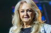 Bonnie Tyler performing on stage during a live concert, remembered following her death at 75 for iconic hits including Total Eclipse of the Heart and Holding Out for a Hero.
