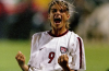 Mia Hamm in a United States Women's National Team jersey during her playing career, celebrating her lasting legacy as one of the greatest soccer players in history.