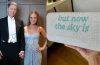 Glennon Doyle and Abby Wambach arrive at Taylor Swift and Travis Kelce's wedding, with Doyle carrying an "Opalite"-inspired custom clutch.