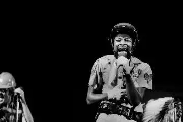 Victor Willis performs on stage with Village People during a live concert, celebrating the legendary singer's lasting impact on disco music after his death at age 74.