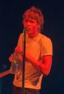Moses Martin poses in Burberry's "Escape to the Countryside" campaign, marking his first professional modeling appearance while showcasing his effortless style.