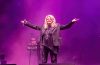 Bonnie Tyler performing on stage during a live concert, celebrating the legendary singer's decades-long career and lasting musical legacy.