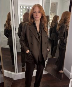 Jessica Chastain showcasing her jaw-grazing copper bob hairstyle during Taylor Swift's wedding weekend, highlighting one of the season's biggest celebrity hair transformations.