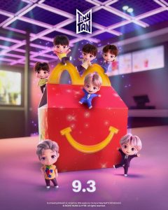 A McDonald's Happy Meal box displayed alongside colorful BT21 collectible character toys inspired by BTS, promoting the limited-time collaboration.