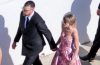 Taylor Swift and Travis Kelce arriving in elegant formal attire at JuJu Smith-Schuster's wedding, showcasing coordinated fashion during one of their first public appearances after their reported wedding celebrations.