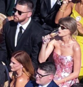 Taylor Swift and Travis Kelce arriving in elegant formal attire at JuJu Smith-Schuster's wedding, showcasing coordinated fashion during one of their first public appearances after their reported wedding celebrations.