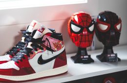 A collage of Tobey Maguire, Andrew Garfield, and Tom Holland as Peter Parker, highlighting the iconic sneakers worn across different Spider-Man film eras.