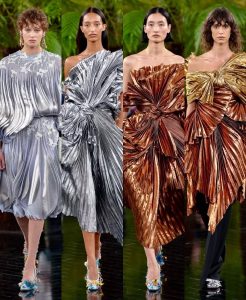 Model wearing Dior Fall/Winter 2026–2027 Haute Couture Look 57, featuring a white silk chiffon ensemble embroidered with cactus flowers and finished with artistic frayed edges.