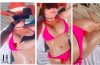 Britney Spears relaxes poolside in a bright pink bikini while covering one nipple with a rose emoji in a new Instagram video.