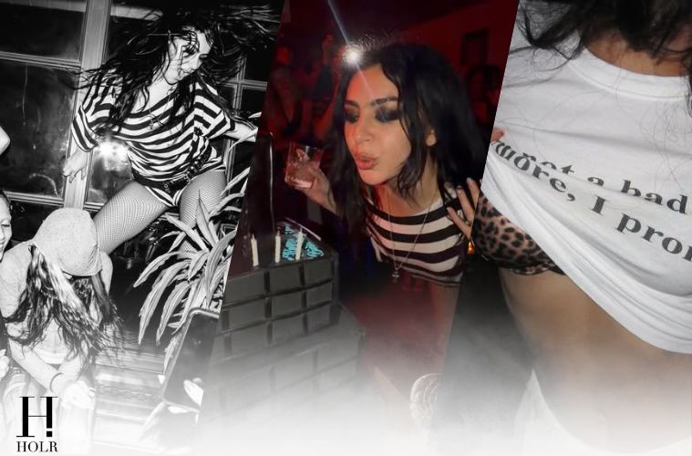 Charli XCX celebrates her 33rd birthday with a black birthday cake during a party with friends.