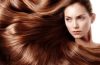Woman with long healthy shiny hair following an everyday hair care routine