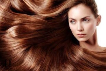 Woman with long healthy shiny hair following an everyday hair care routine