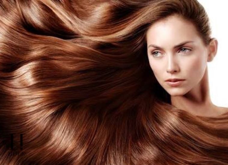 Woman with long healthy shiny hair following an everyday hair care routine