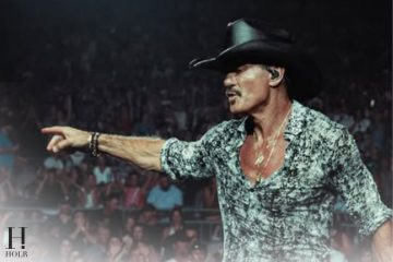 Tim McGraw performs onstage during his Cincinnati concert before taking a fall