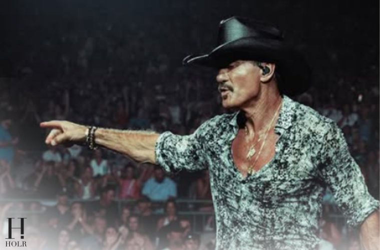 Tim McGraw performs onstage during his Cincinnati concert before taking a fall