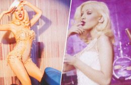 Christina Aguilera wears a glamorous red look and headphones in a retro-inspired photo from her B2B Back to Basics outtakes carousel.