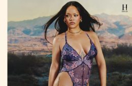Rihanna poses behind a construction barricade in a floral Savage X Fenty teddy from the Curves Ahead campaign.