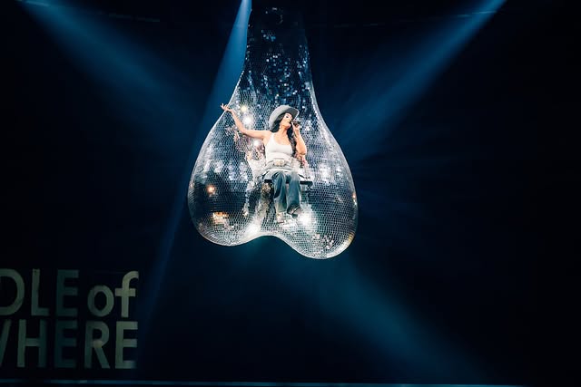 Kacey Musgraves performs above the crowd on giant mirrored disco balls during her Middle of Nowhere Tour opening night in Chicago.