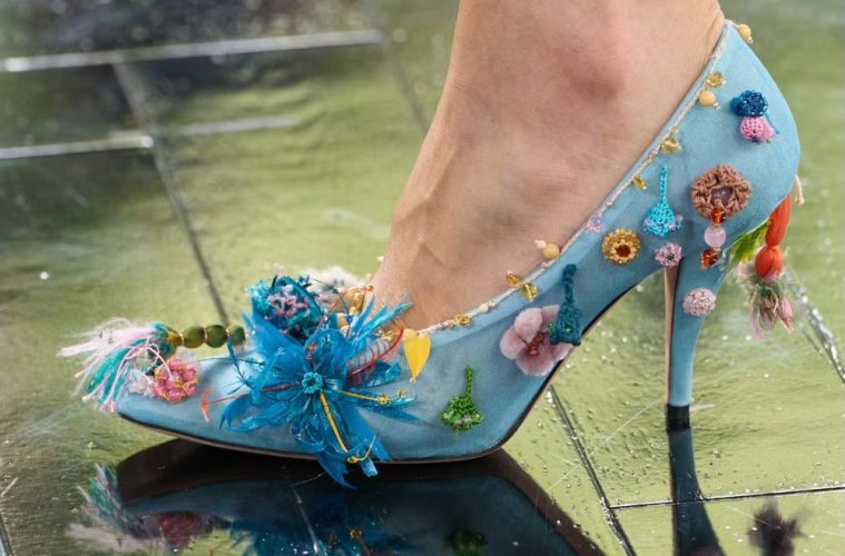 A whimsical embellished heel decorated with colorful floral and playful details from the fall 2026 fashion trend.