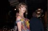 Taylor Swift wears a black floral Veronica Beard slip dress with white accessories at an Emmy event in Los Angeles.
