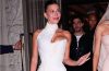 Hailey Bieber wears a sheer creamy nude manicure with a glossy finish in the sweet cream nail trend.
