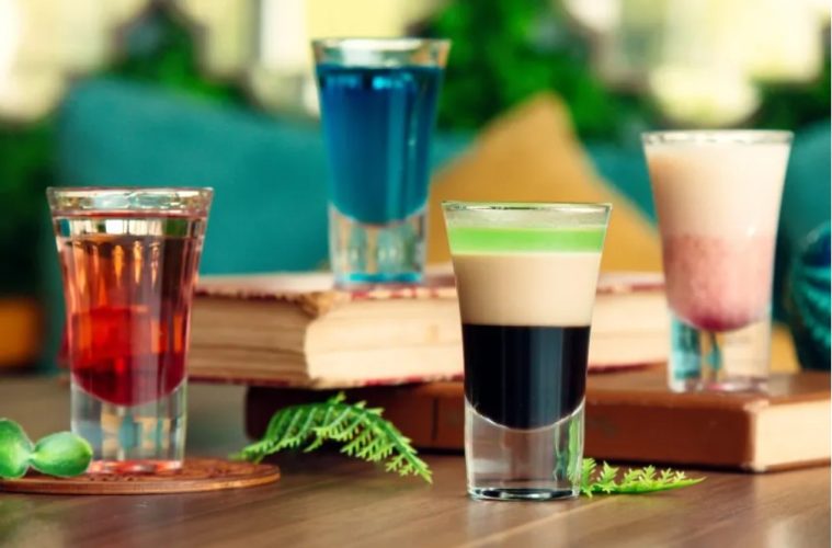 A selection of colorful modern beverages featuring sparkling fruit drinks, botanical sodas, tea, and alcohol-free spritzes.