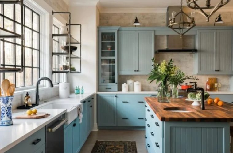 A bright kitchen refreshed with updated cabinets, lighting, open shelving, accessories, and colorful decorative details.