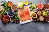 A healthy MIND diet meal featuring leafy greens, berries, whole grains, nuts, and other brain-friendly foods.