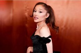 Ariana Grande addresses fans on stage while explaining her decision to take a planned break from public visibility.